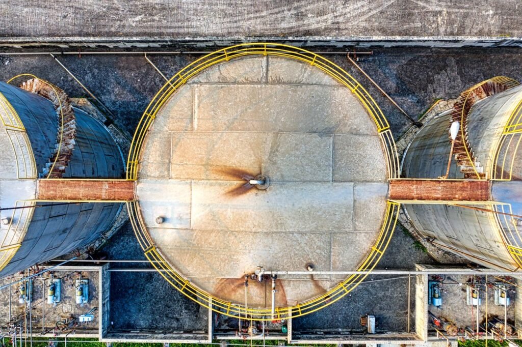 Crafting Captivating Headlines: Your awesome post title goes here Top view of huge industrial tanks connected with rusty passages located at territory of factory