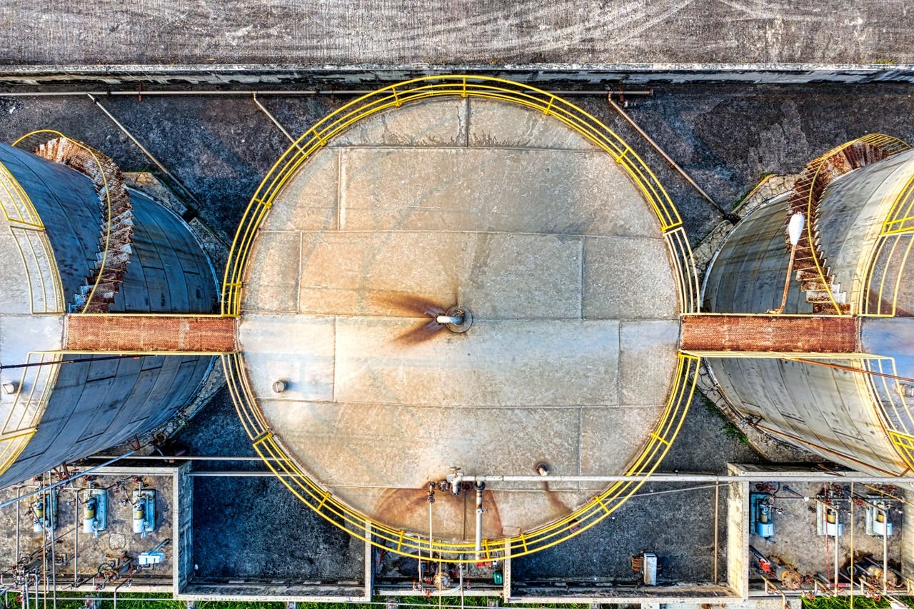 Crafting Captivating Headlines: Your awesome post title goes here Top view of huge industrial tanks connected with rusty passages located at territory of factory